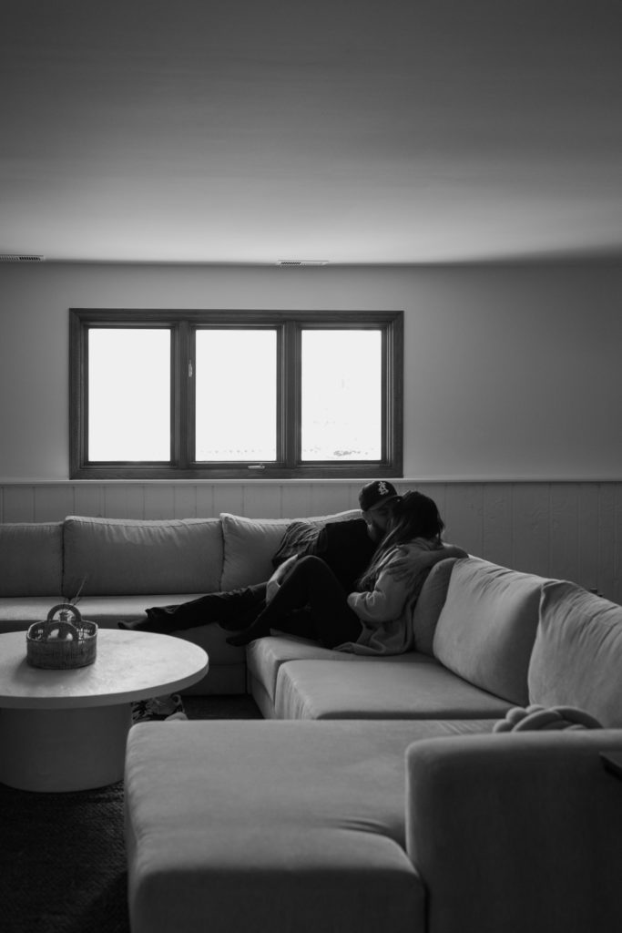 boyfriend and girlfriend enjoy a quiet moment together in their first home