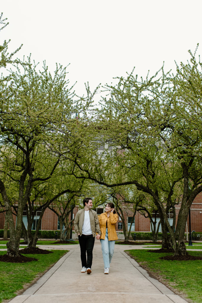 two fiancés take a stroll at the place where they met, depaul university in chicago, illinois