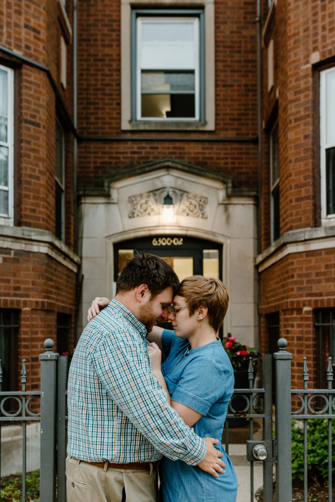 a man an woman hold each other at the place where they first met in rogers park, in chicago, illinois