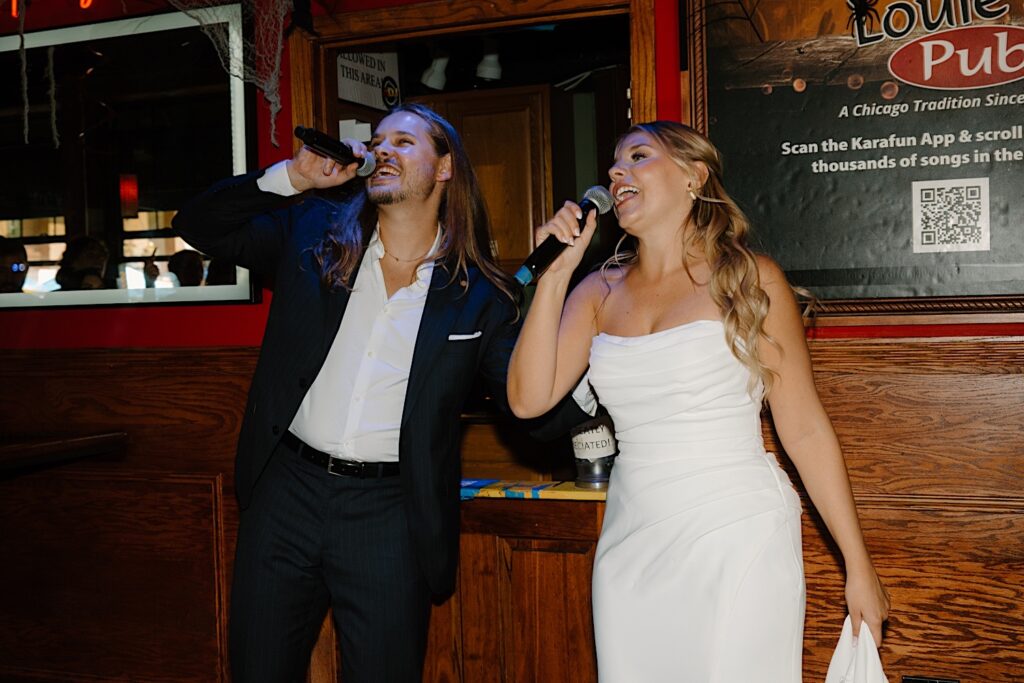 A bride and groom sing together at their favorite Chicago bar before their intimate wedding day.