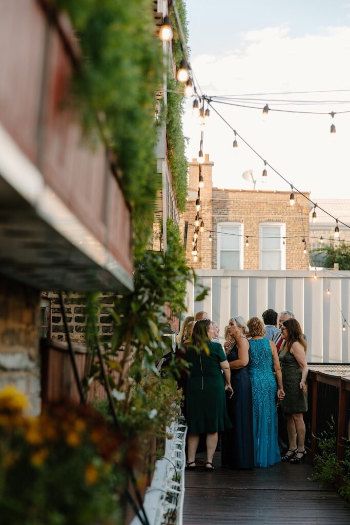 Guests wait for the wedding ceremony to start at the Chicago rooftop wedding venue. 