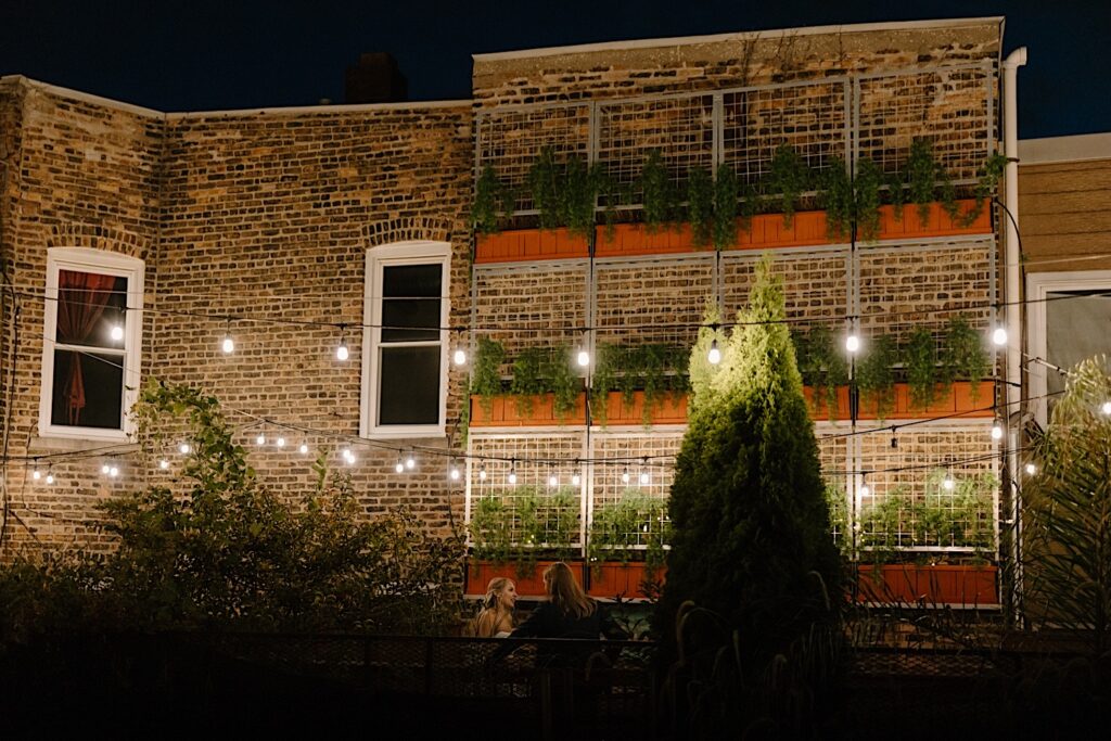 A bride and groom have an intimate moment alone on the rooftop of their wedding venue before heading into Homestead On the Roof for their intimate wedding dinner. 