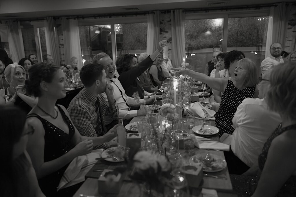 Guests shout and laugh with one another as they celebrate their loved ones at Homestead on the Roof in Chicago.