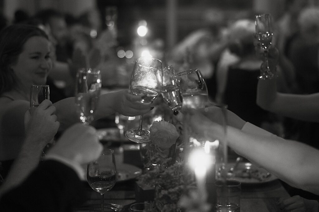 Guests make a toast to the bride and groom at Homestead on the Room in Chicago. 